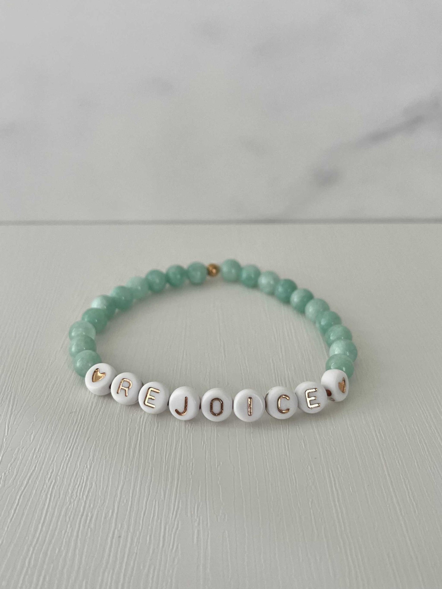 Rejoice Green Jade Bracelet showcasing beautiful green jade stones, ideal for expressing faith and adding a touch of elegance to your jewelry collection.