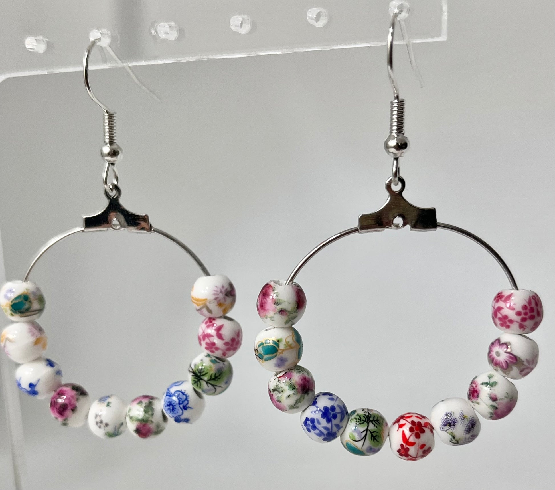 Multicolored floral ceramic silver hoop earrings