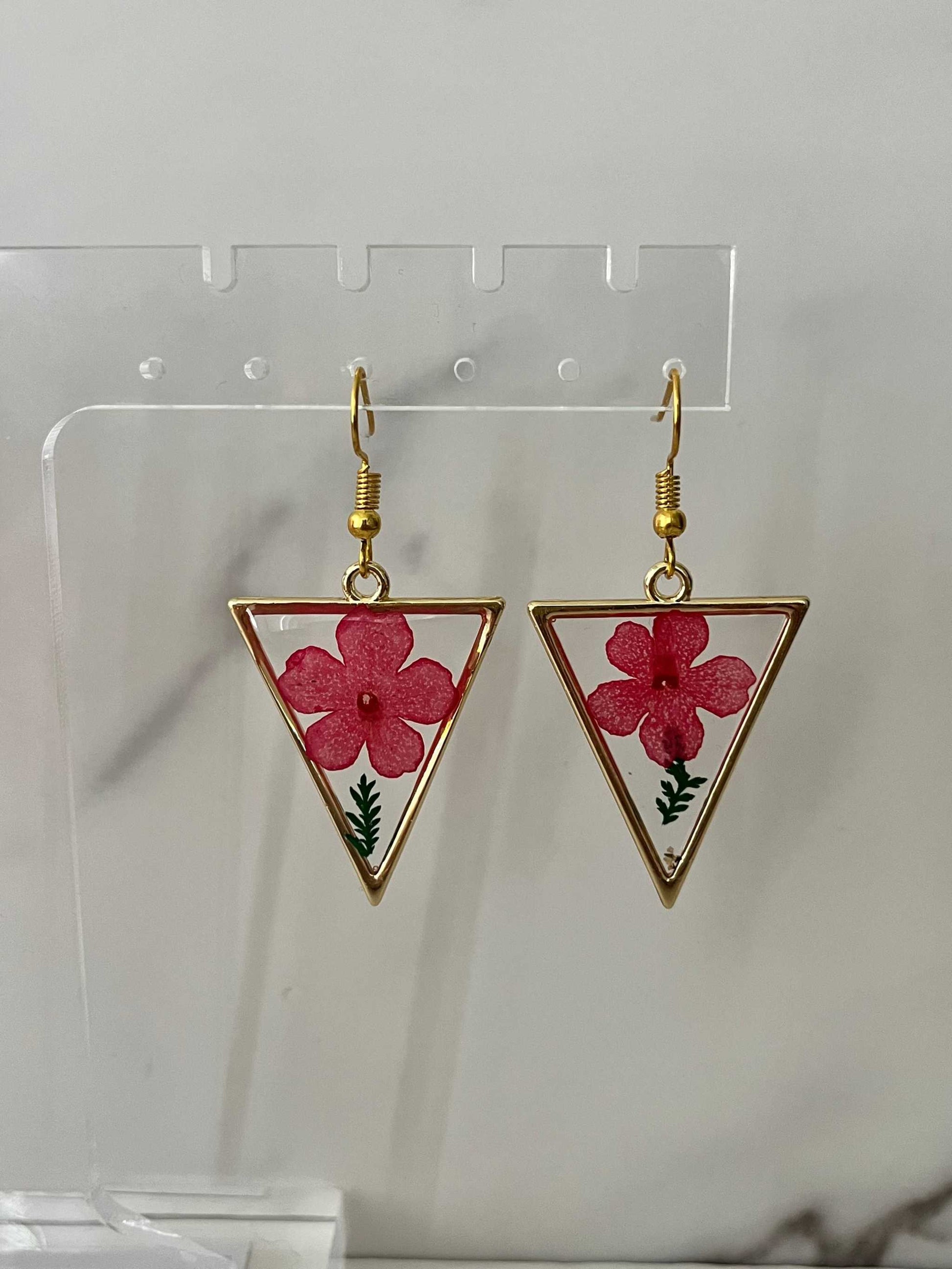 Gold triangle earrings with dried flower accents