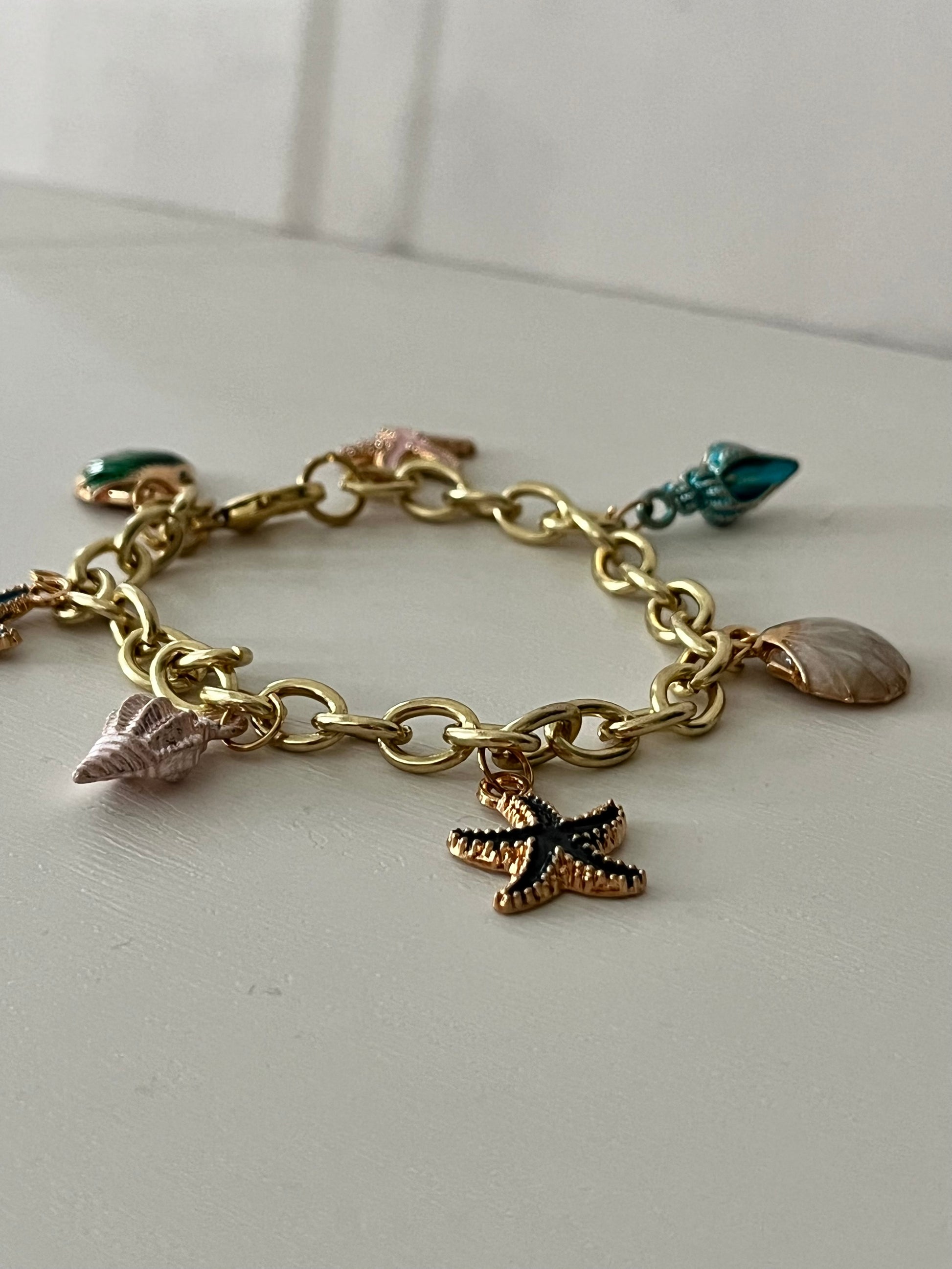 Gold ocean beach charm bracelet