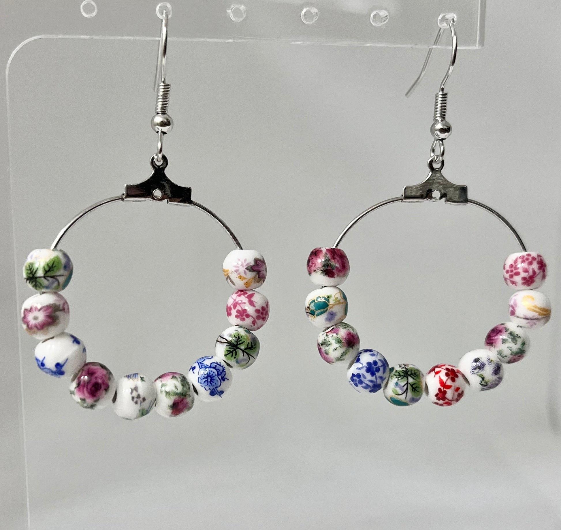 Multicolored floral ceramic silver hoop earrings