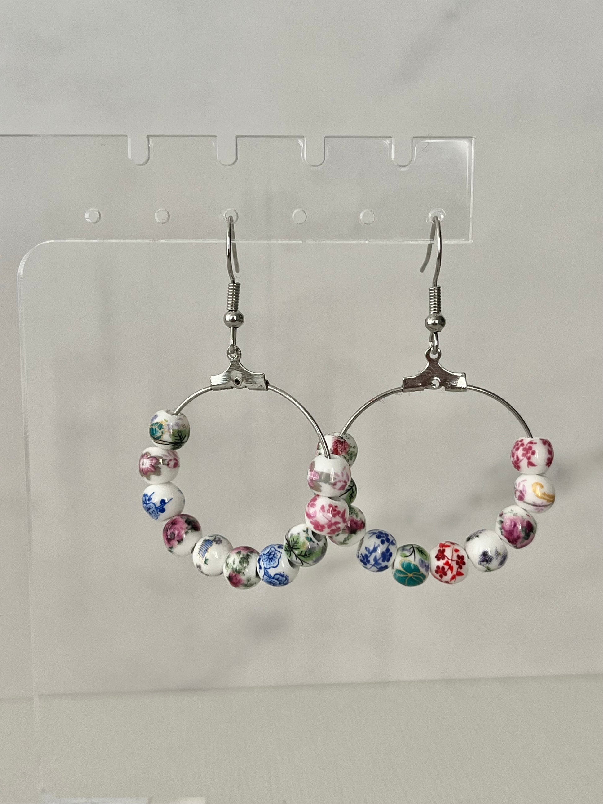 Multicolored floral ceramic silver hoop earrings