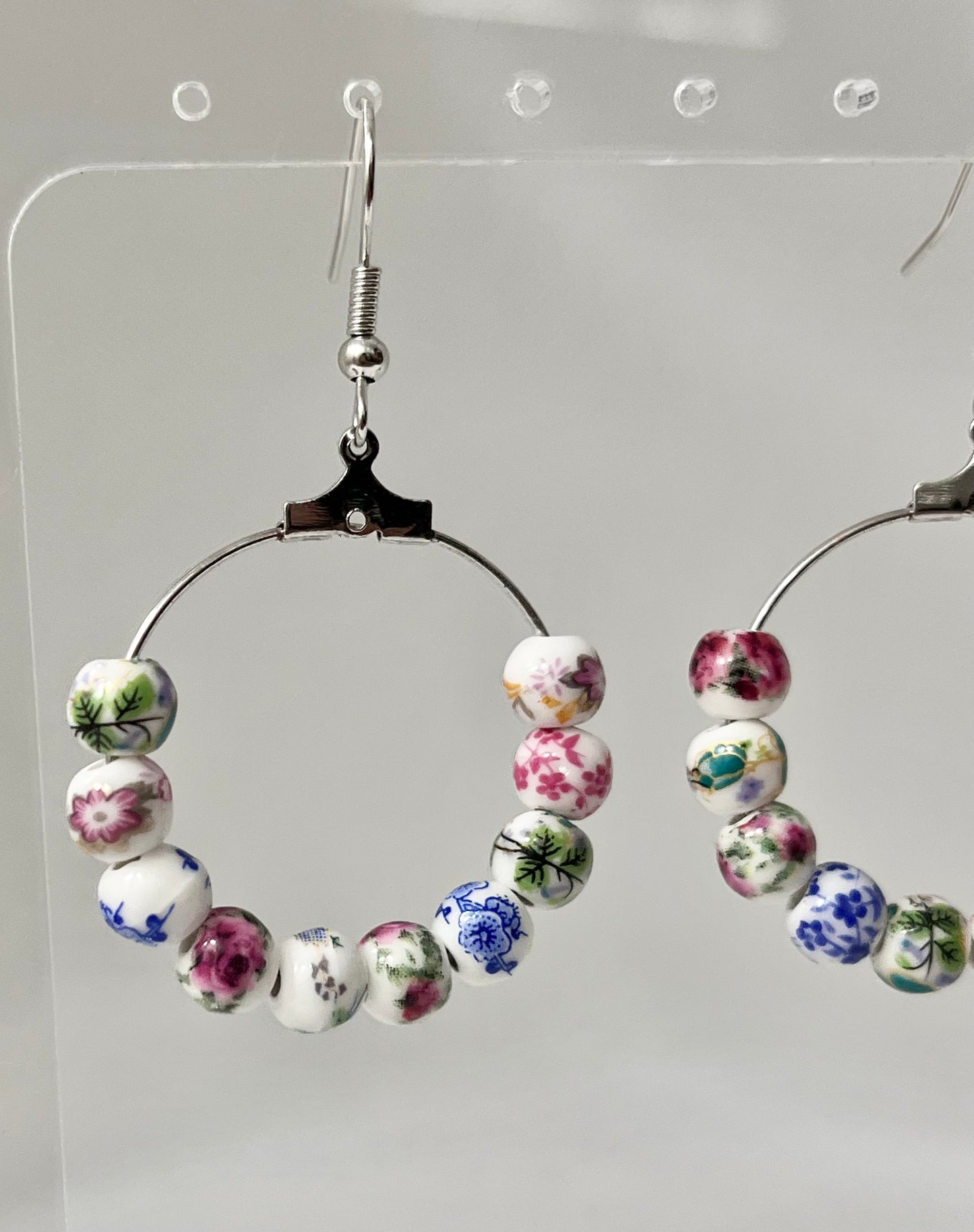 Multicolored floral ceramic silver hoop earrings