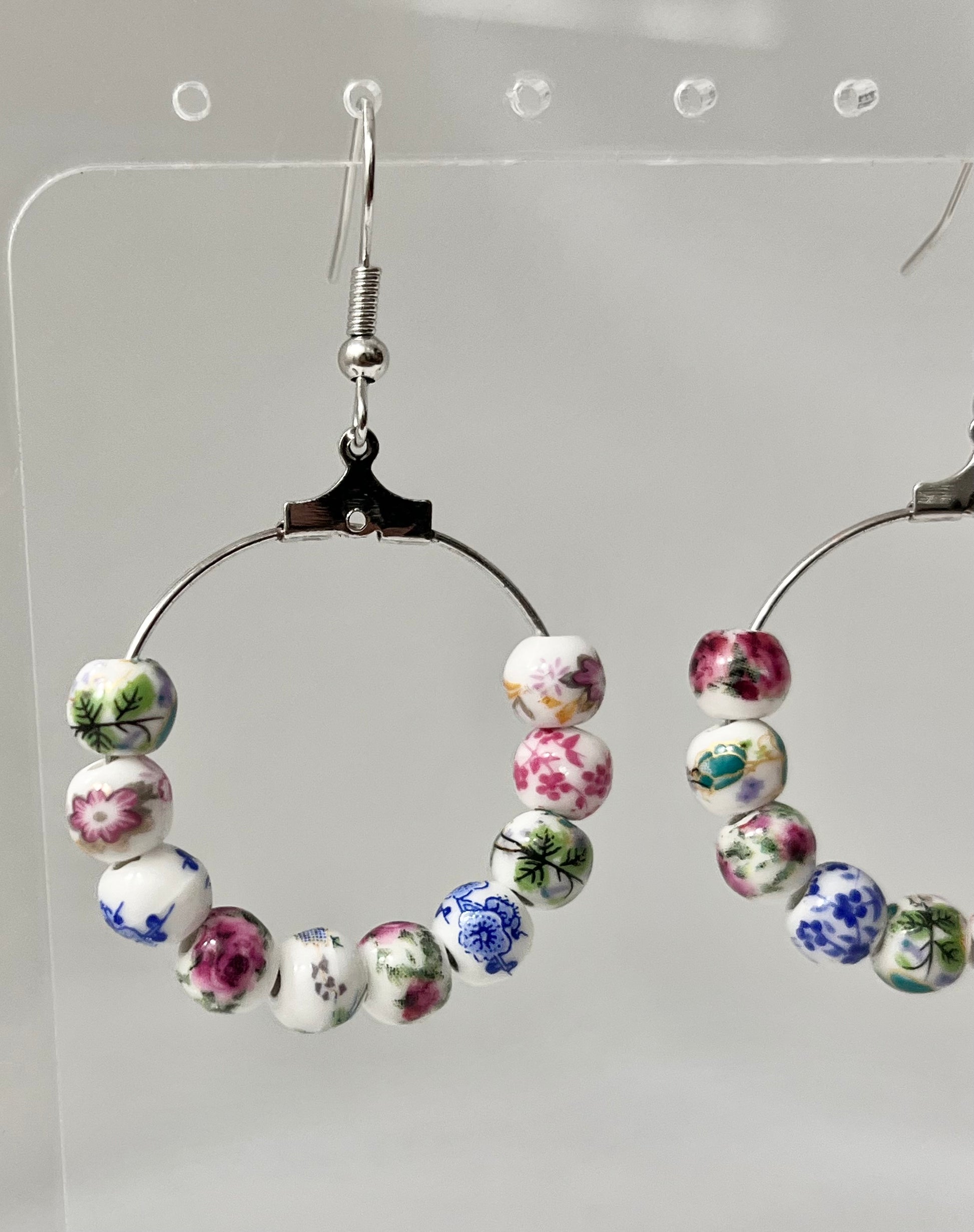 Multicolored floral ceramic silver hoop earrings