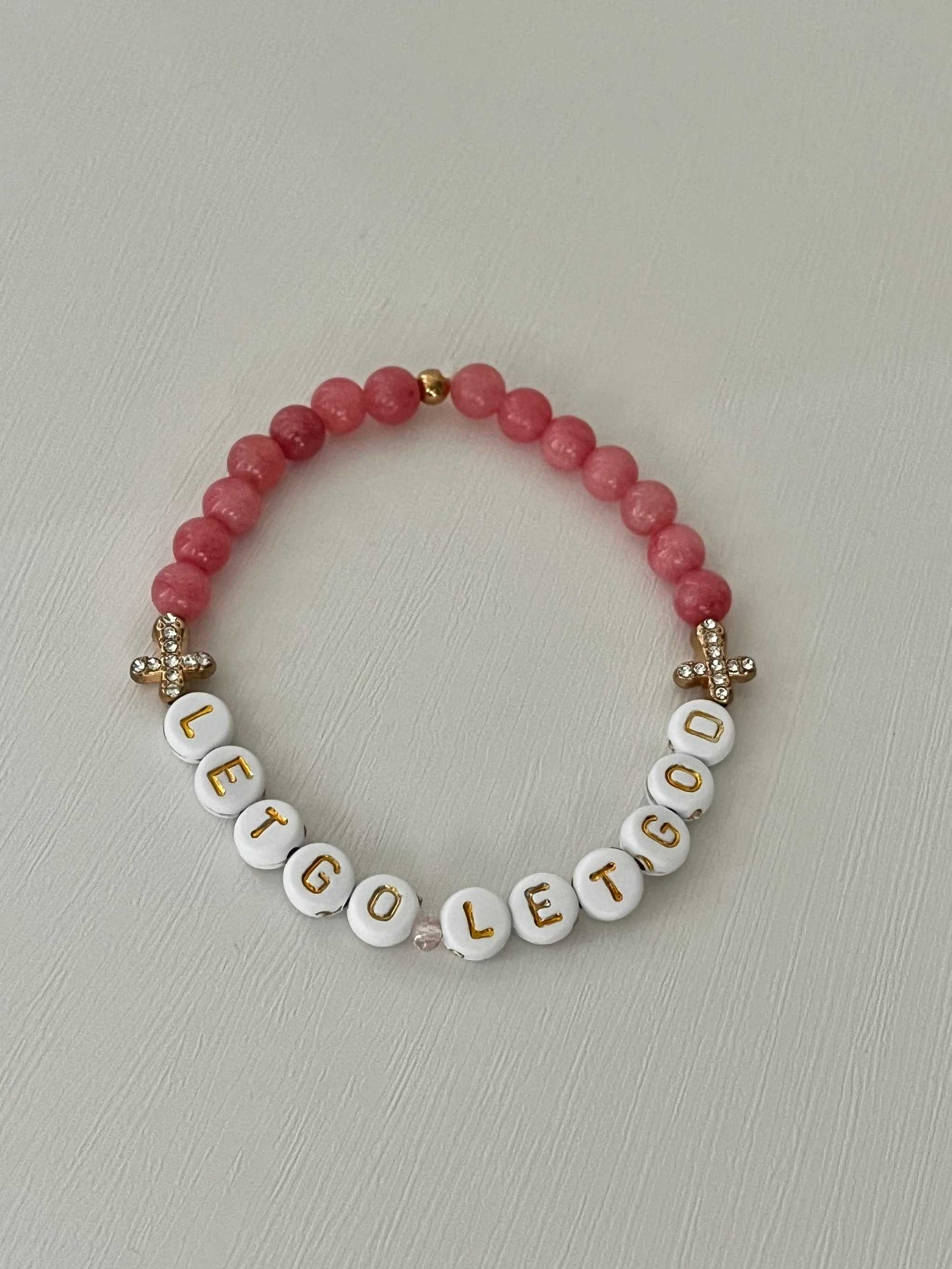 Let Go Let God Bracelet with pink glass marbled beads and gold crosses