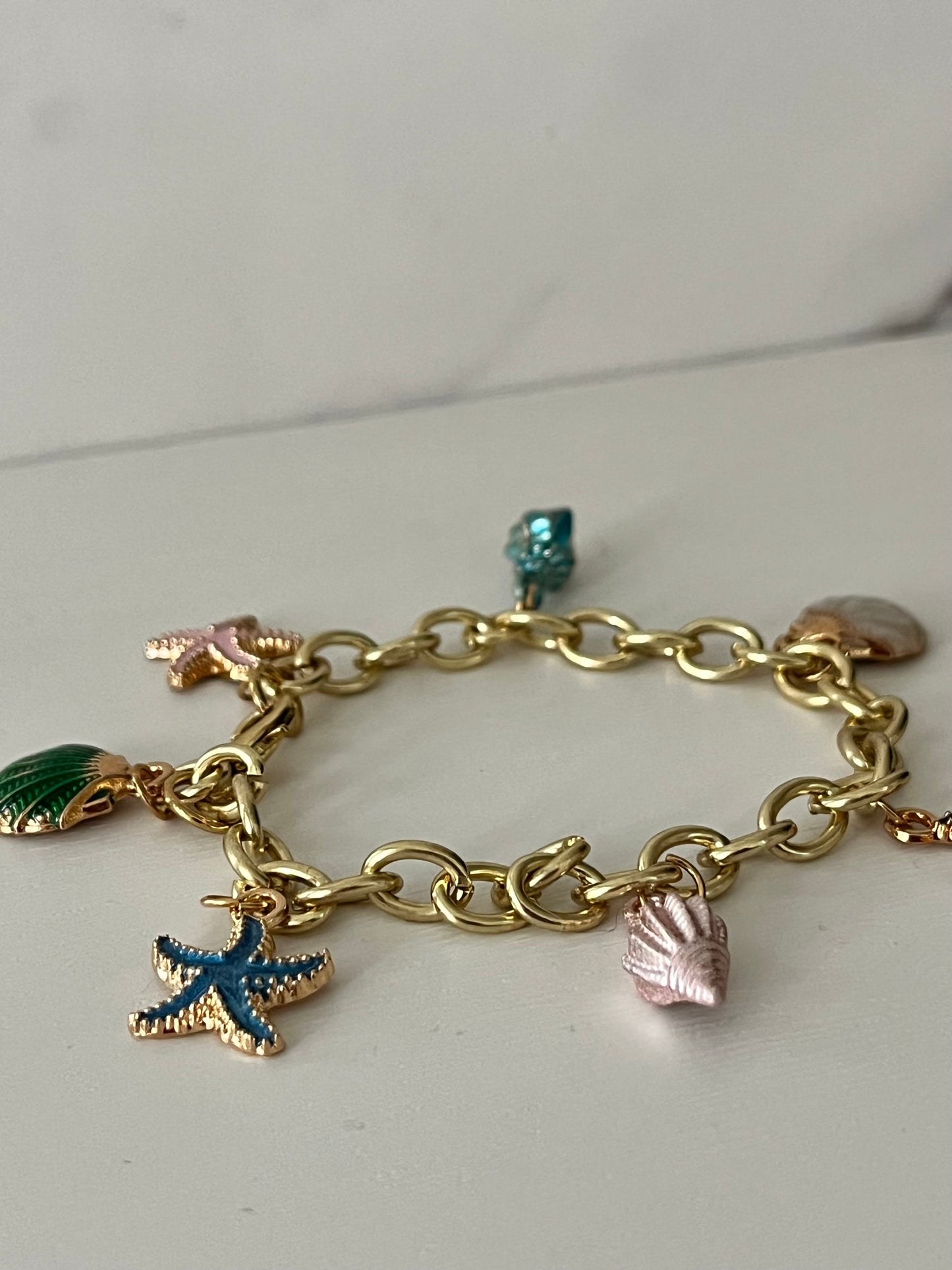 Gold ocean beach charm bracelet