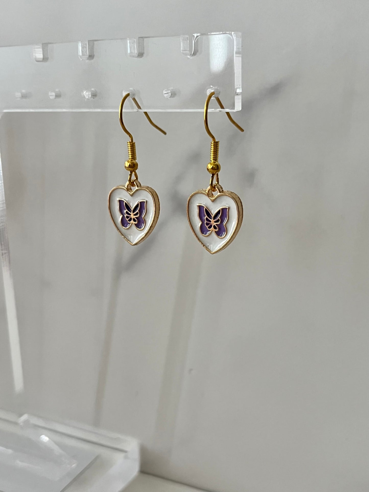 Gold heart shaped purple butterfly earrings