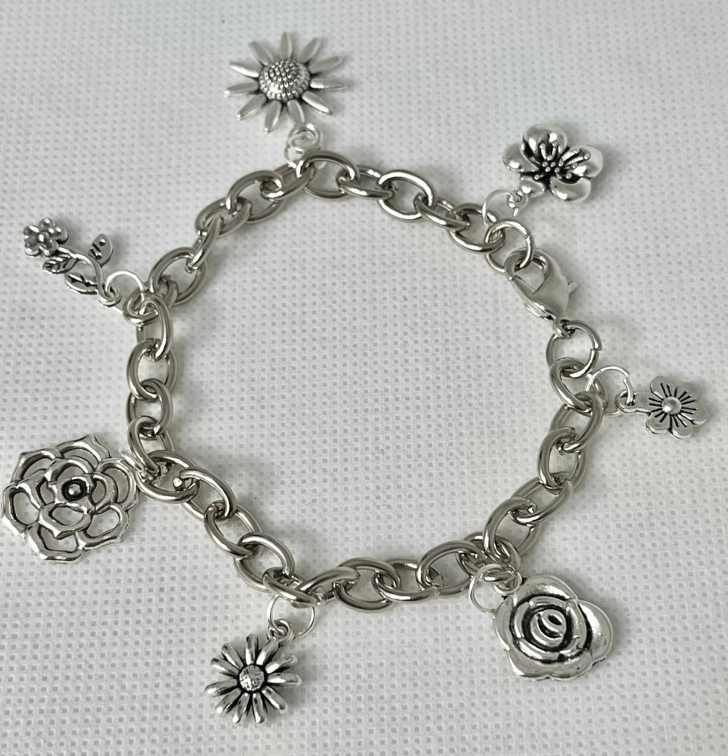 Silver floral charm bracelet