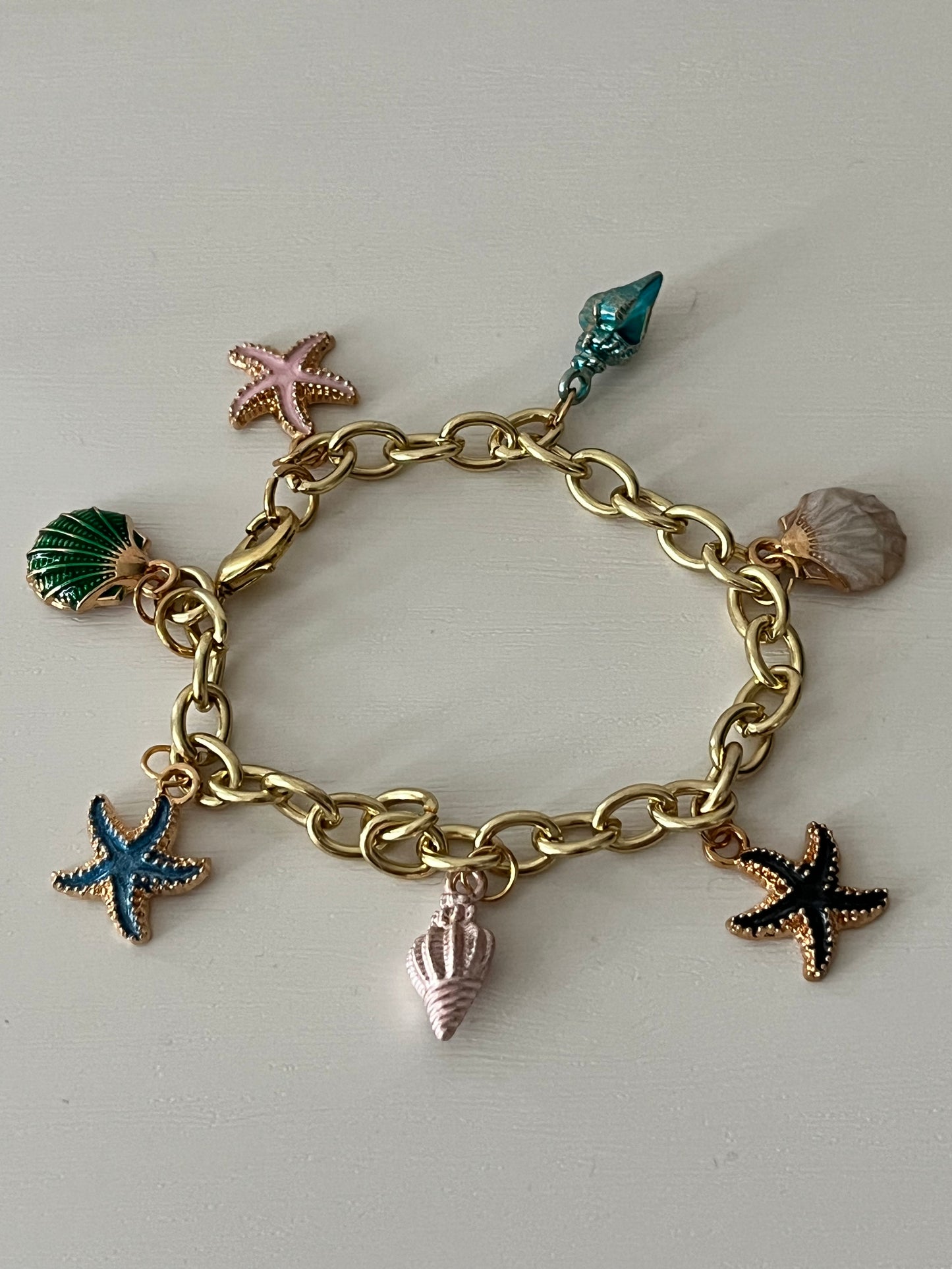 Gold ocean beach charm bracelet