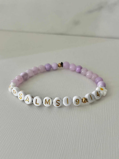 Lavender Daisy Rhodonite Bracelet showcasing white daisies and lavender rhodonite beads, ideal for expressing faith and style.