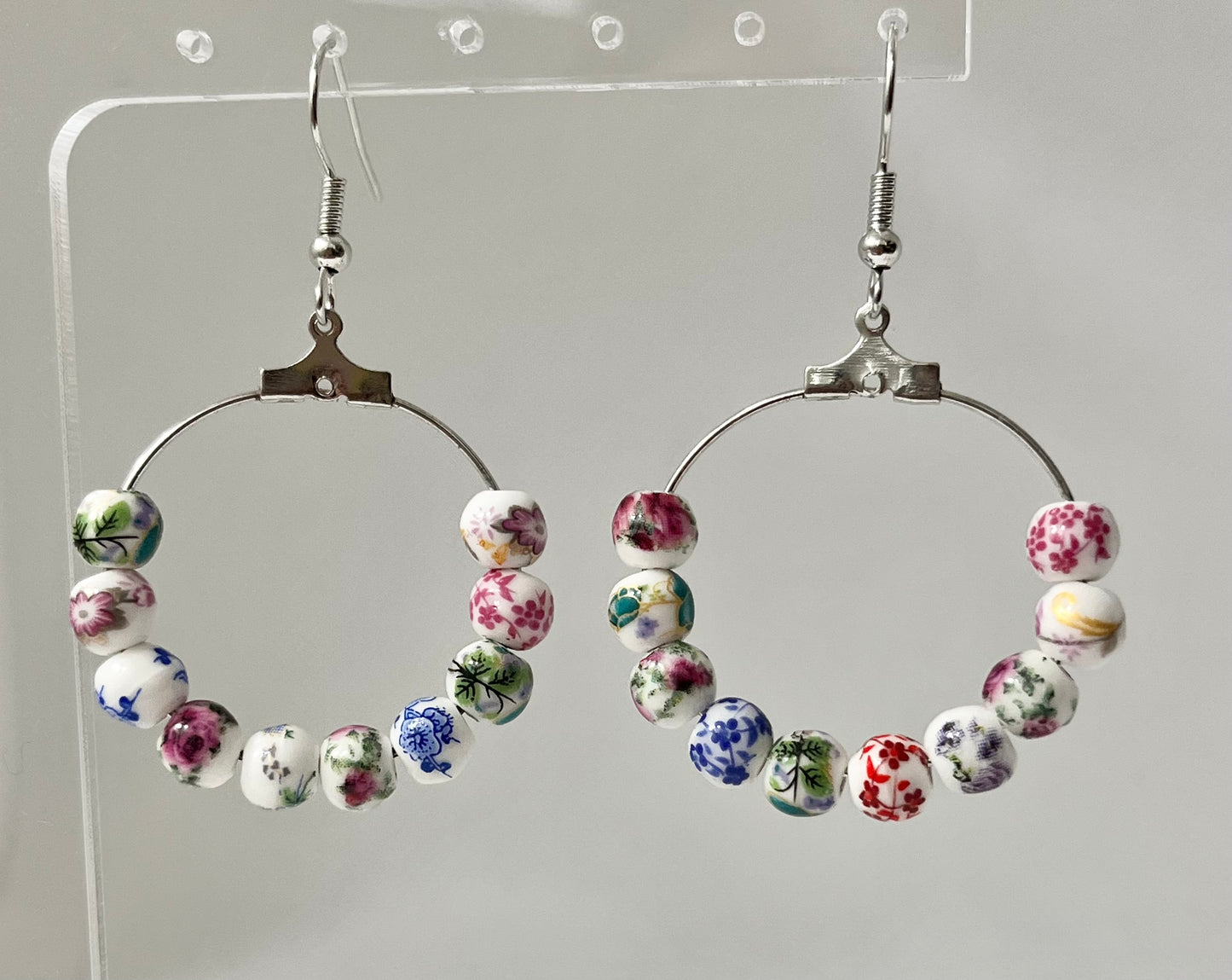 Multicolored floral ceramic silver hoop earrings