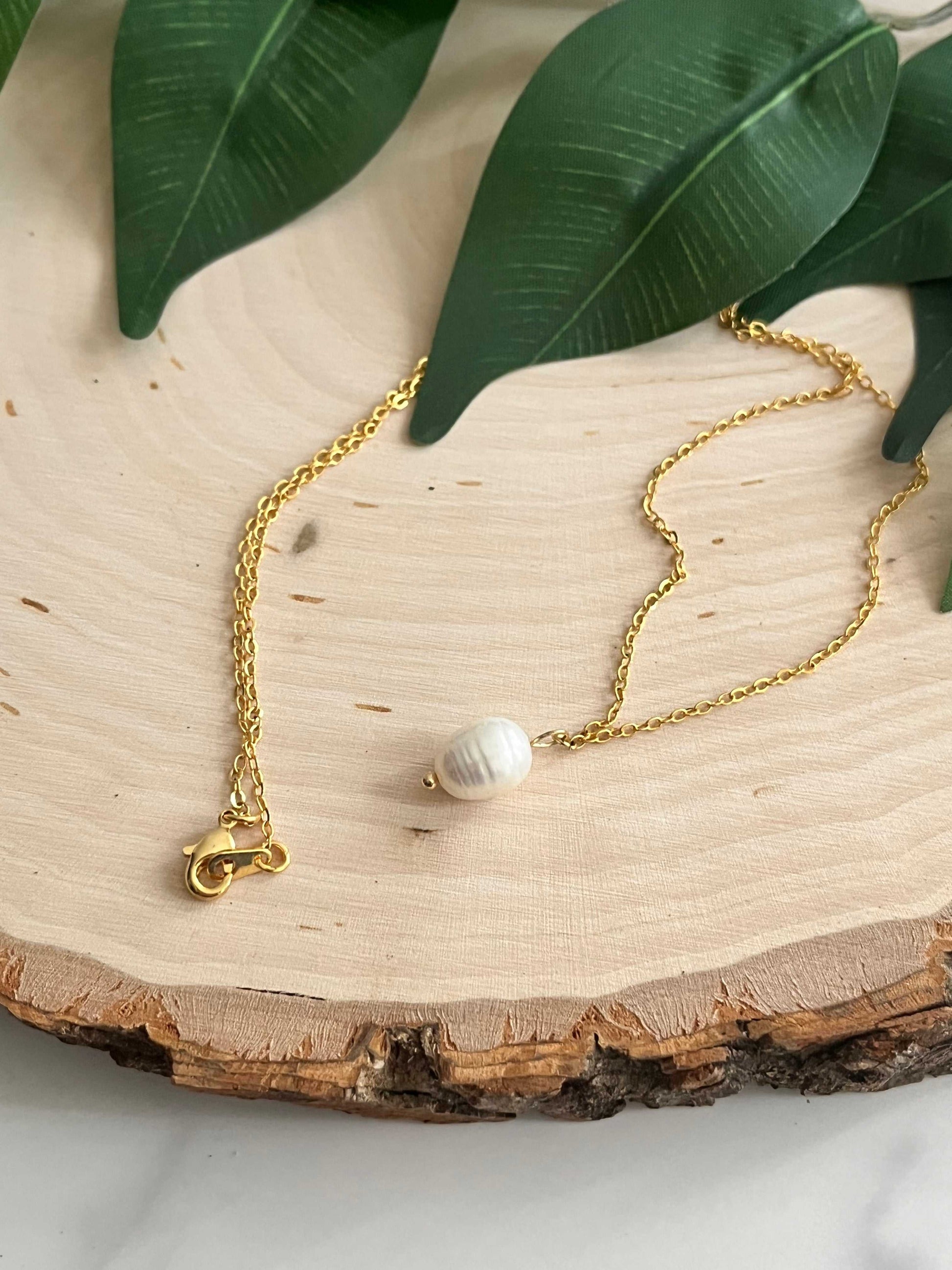 Gold necklace with pearl pendant, inspired by Proverbs 31 for Christian women.