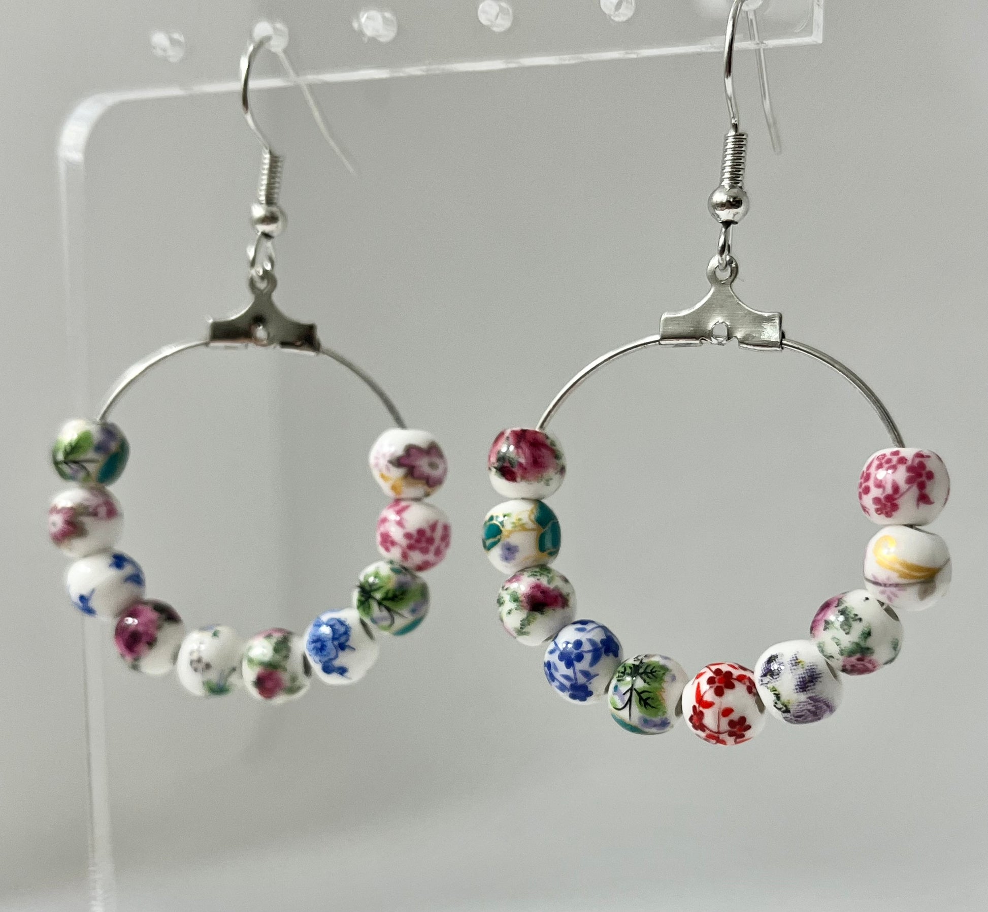 Multicolored floral ceramic silver hoop earrings