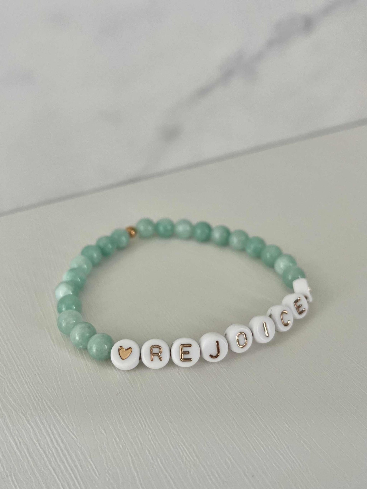 Rejoice Green Jade Bracelet showcasing beautiful green jade stones, ideal for expressing faith and adding a touch of elegance to your jewelry collection.