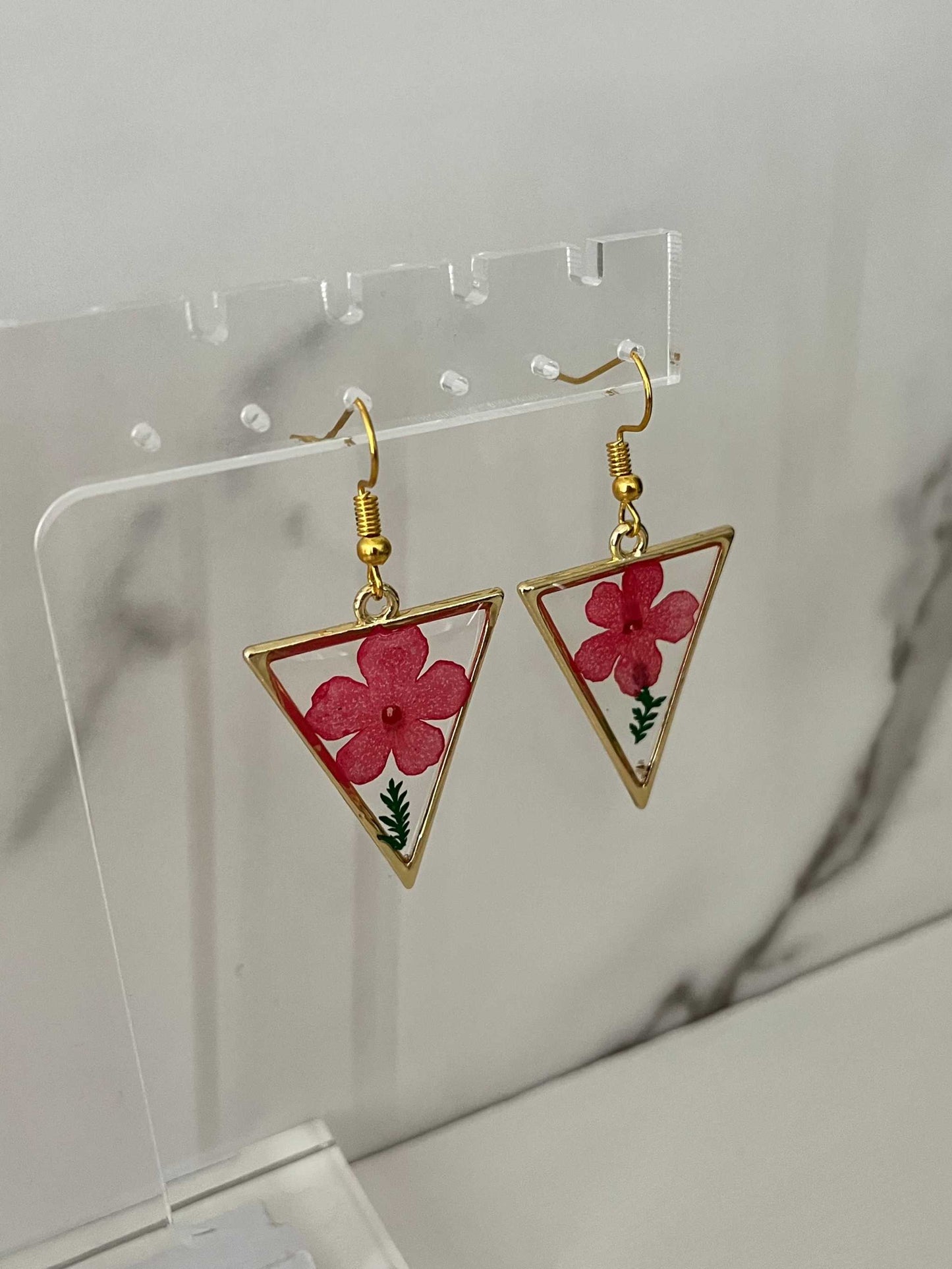 Gold triangle earrings with dried flower accents