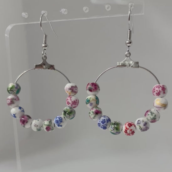 Multicolored floral ceramic silver hoop earrings