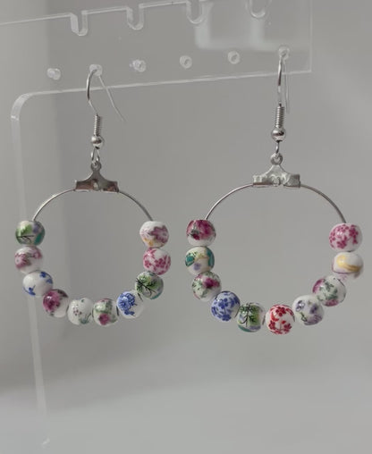 Multicolored floral ceramic silver hoop earrings