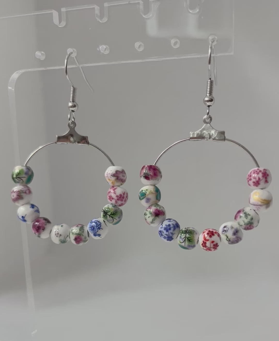 Multicolored floral ceramic silver hoop earrings