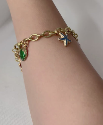 Gold ocean beach charm bracelet