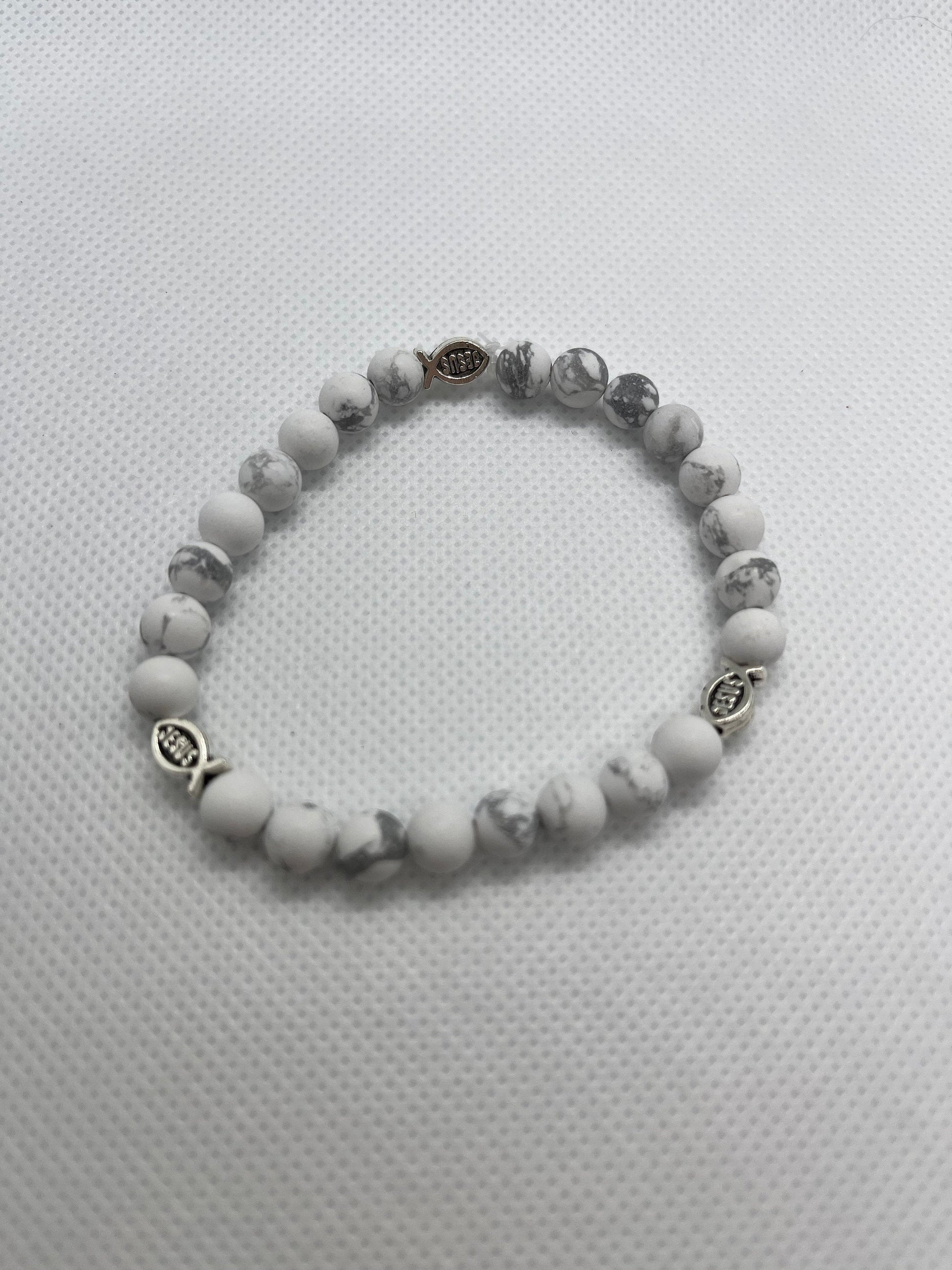 Handcrafted White Marble Jesus Fish Bracelet with 6mm beads, featuring faith-inspired charm and elegant design for a meaningful, everyday accessory