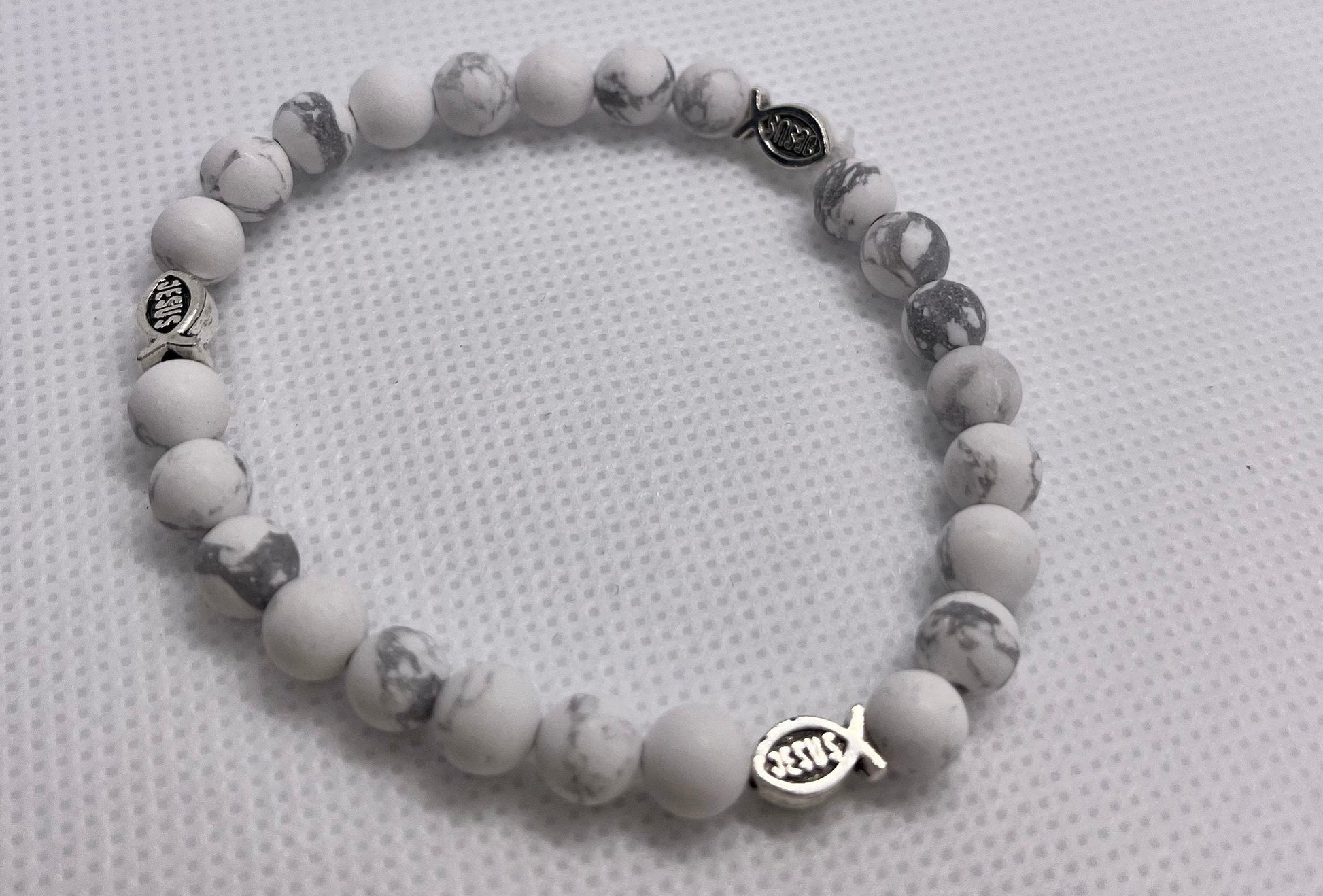 Handcrafted White Marble Jesus Fish Bracelet with 6mm beads, featuring faith-inspired charm and elegant design for a meaningful, everyday accessory